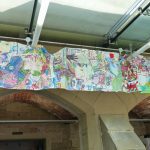 Refugees, Asylum Seekers and Hiraeth Project Leaders view recently installed banners