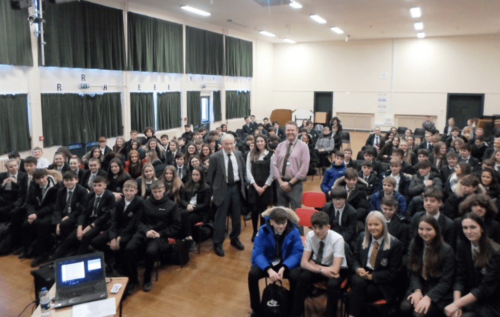 Holocaust survivor Tomi Komoly visits Darland High School to share his experience