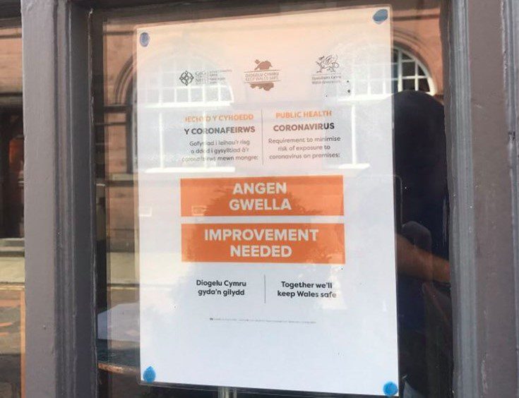 Improvement notice on the window at Chequers in Wrexham