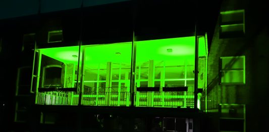 Guildhall front lit in green for Recycle Week 2021