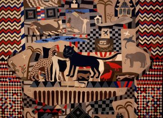 image of the quilt, red, blue and brown in colour with a men depicted with animals