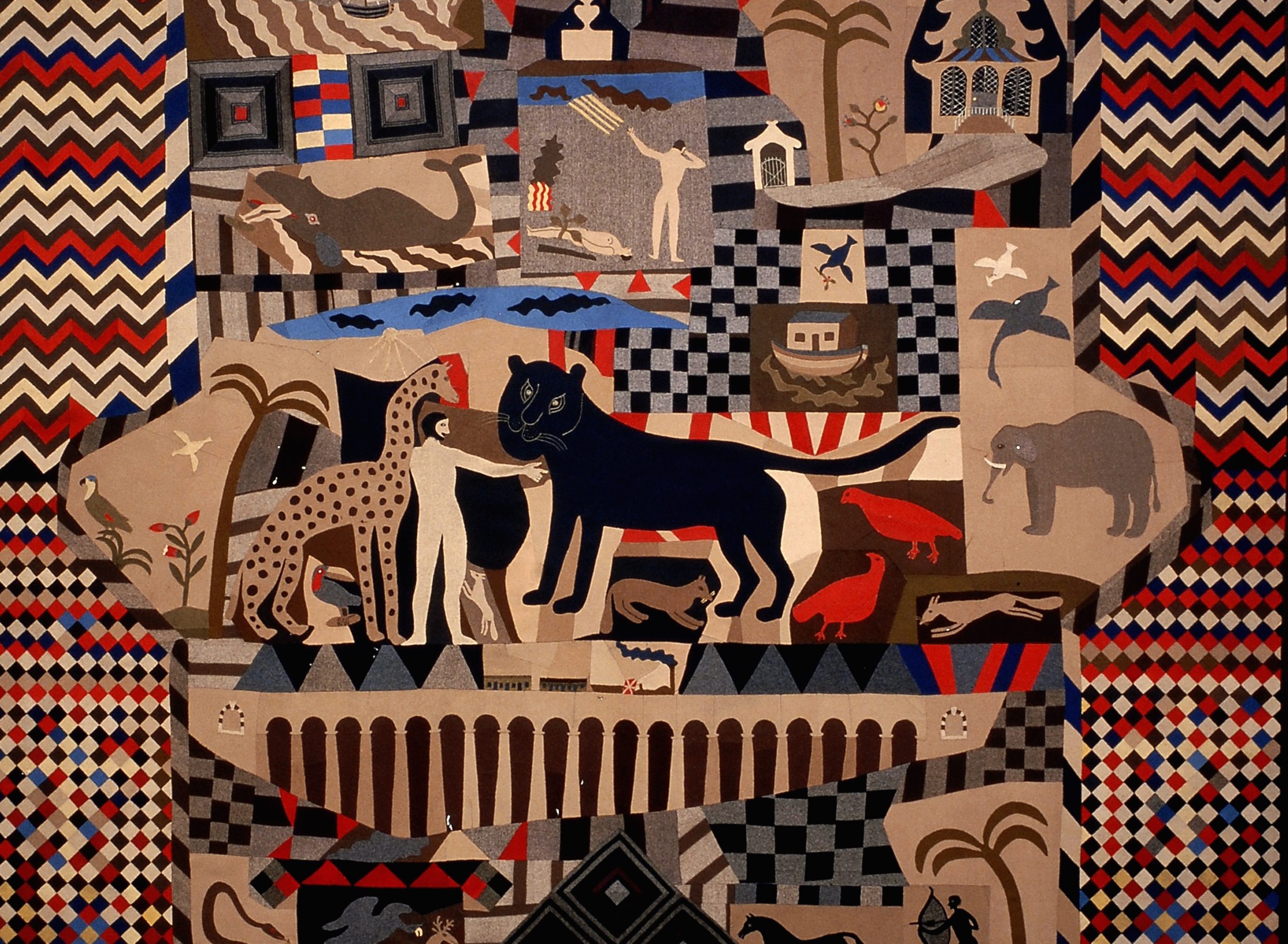 image of the quilt, red, blue and brown in colour with a men depicted with animals