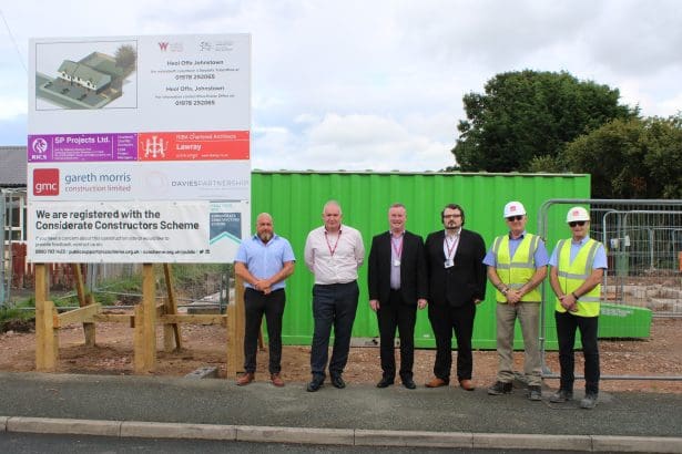 image of 3 housing officers, two construction works and Councillor David Bithell in front of the site