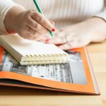 Woman writing in notebook