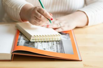 Woman writing in notebook