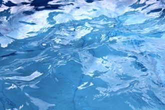 The surface of an indoor swimming pool