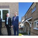 ON the left of the image is the Managing Director of Gower Homes, to his right is Councillor Paul Blackwell, and then two Housing Officers. This Image is a collage image, so at the right of the image inclyde a photograph of the exterior of the home that the article is referring to