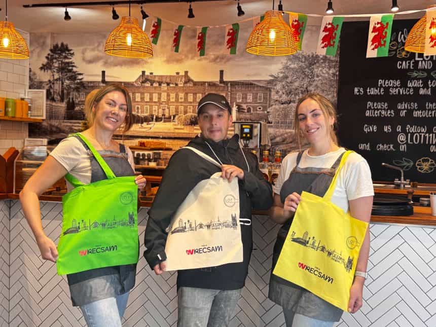 This is Wrecsam and Lot 11 tourim initiative - image shows Lot 11 owner Sarah Baker with artist Mikey Jones and Lot 11 staff member Beth Williams