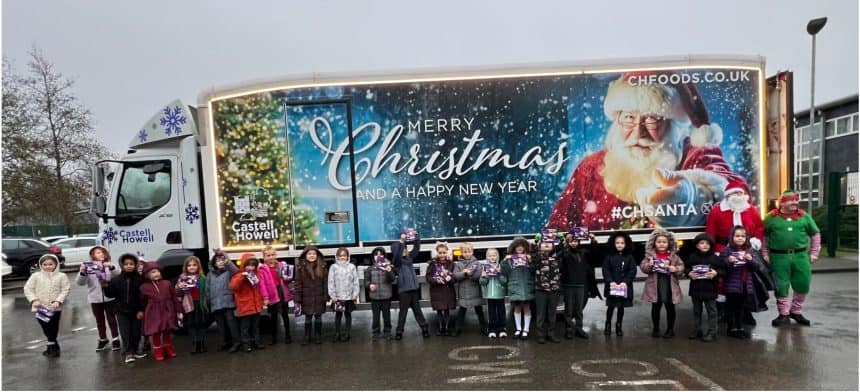 Pupils with Santa and the Castell Howell Foods Christmas truck