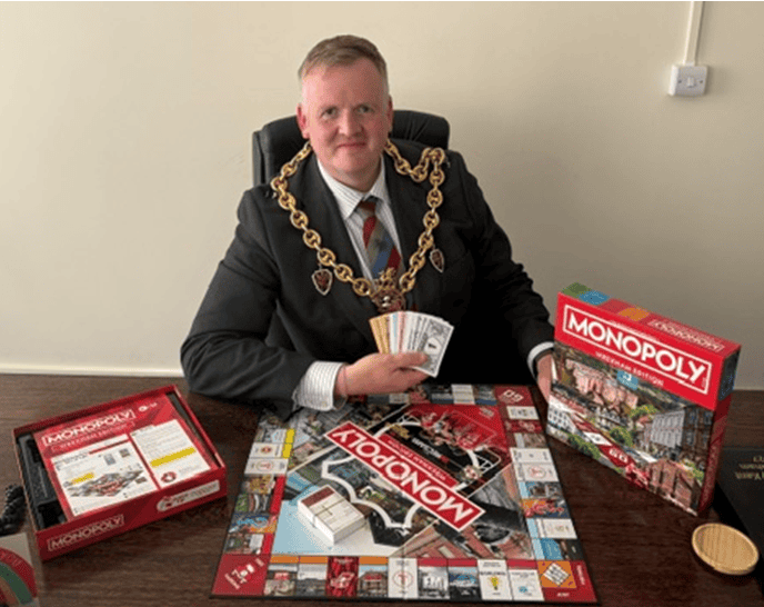 Mayor receiving his copy of the new Monopoly Wrexham edition board